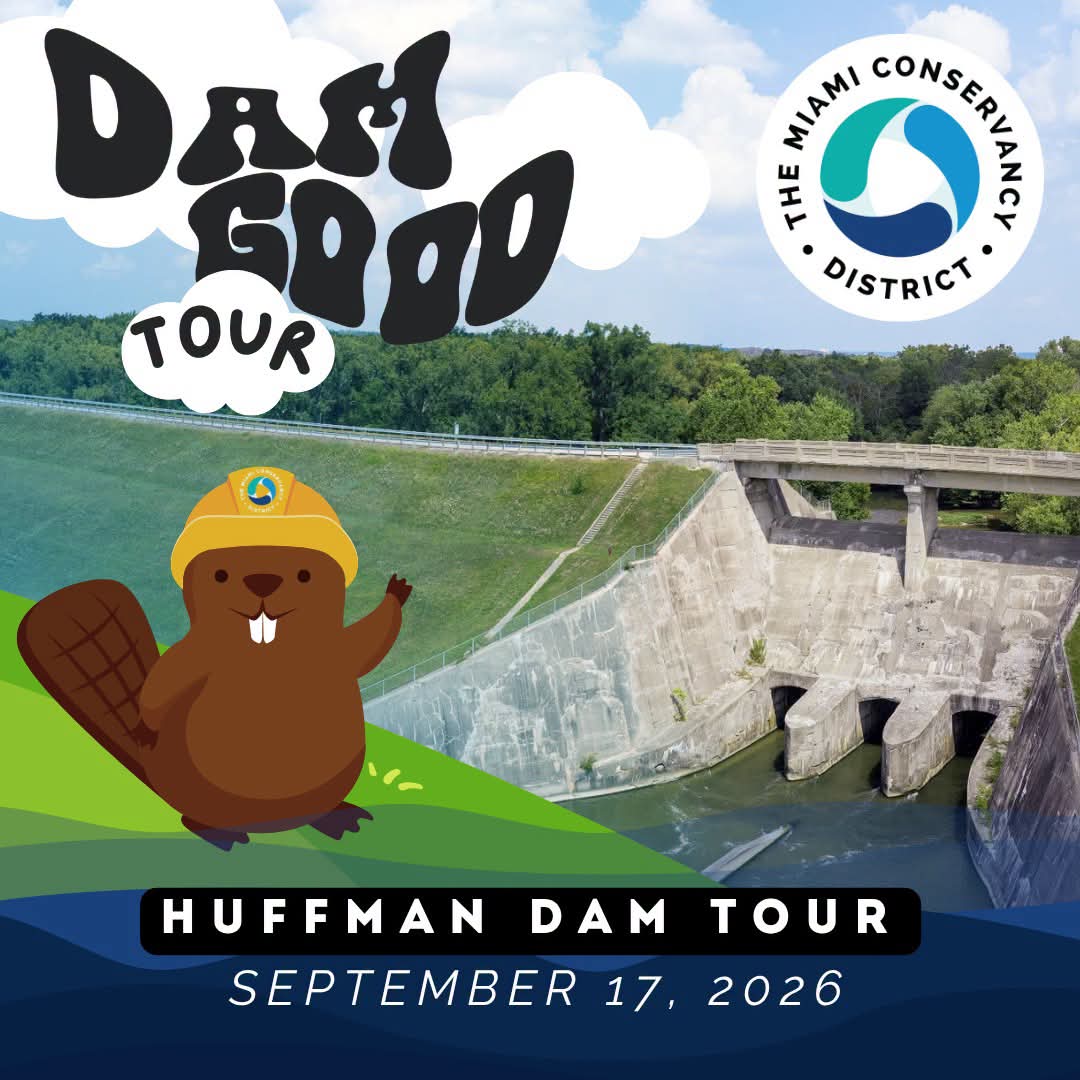 Image of Huffman Dam with the logo for the Miami Conservancy District overhead and the mad river flowing below the dam. A cartoon beaver with a yellow hat waves with outstretched paw. The image reads "Dam Good Tour" Huffman Dam Tour September 17, 2026.