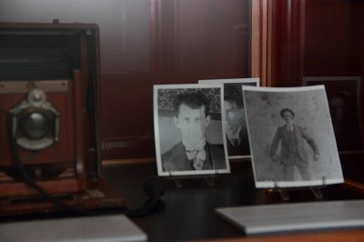 Vintage camera and photos on display