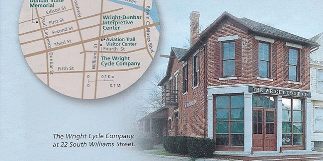 A two-story brick building on the right and a map image on the left showing the location of the park in Dayton.