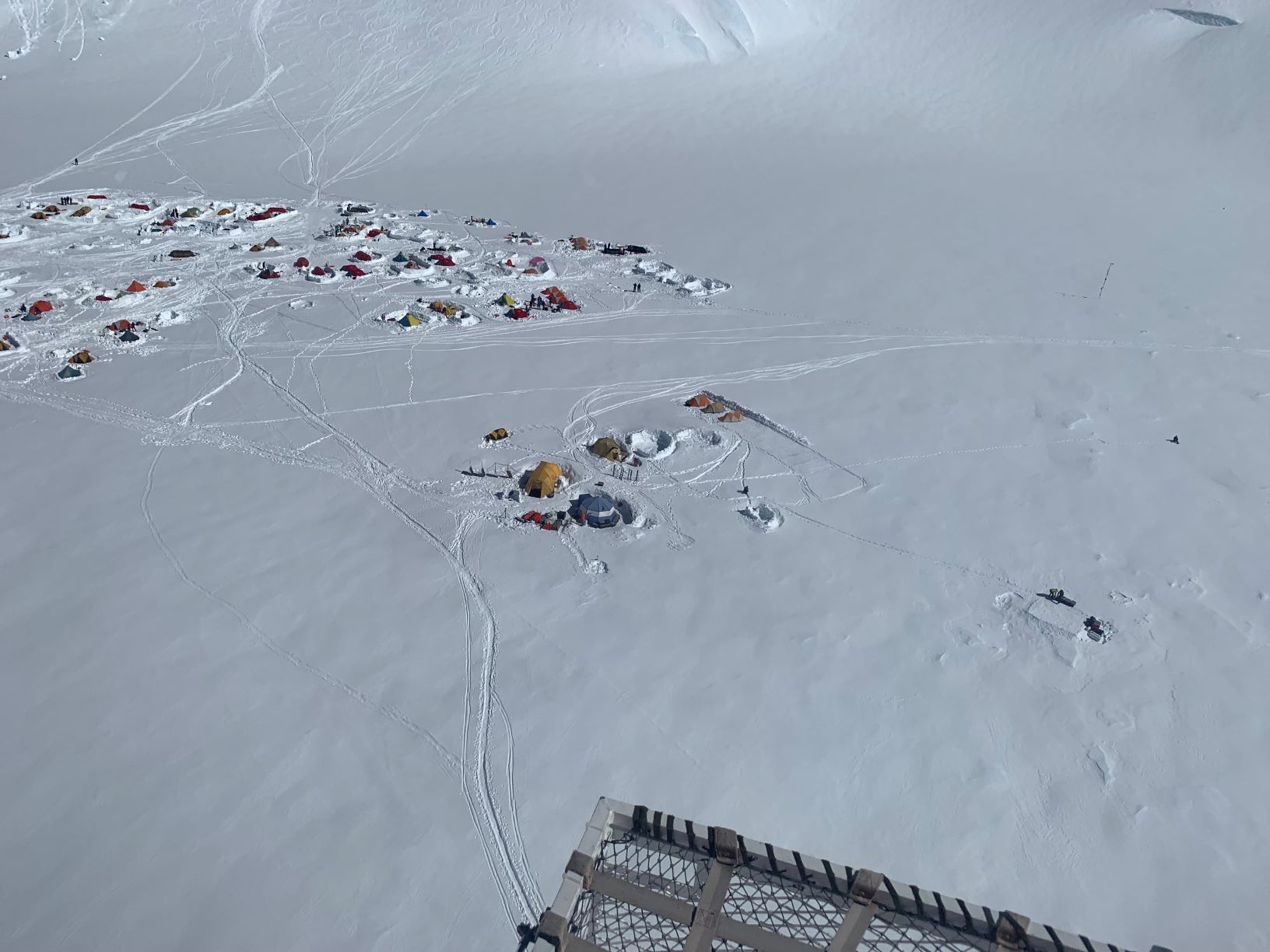 14 Camp, from above Aerial view of a busy tent village on a snowy glacier
