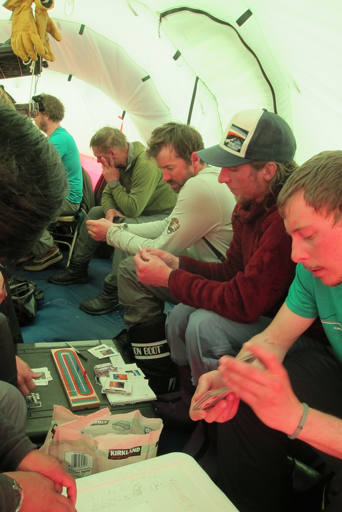 Climbers play endless card games during bad weather days. Climbers play endless card games during bad weather days.