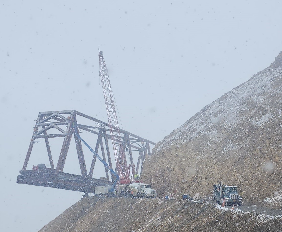 2025-05-08 sleet and snow The finished east end of the bridge with heavy snow falling.