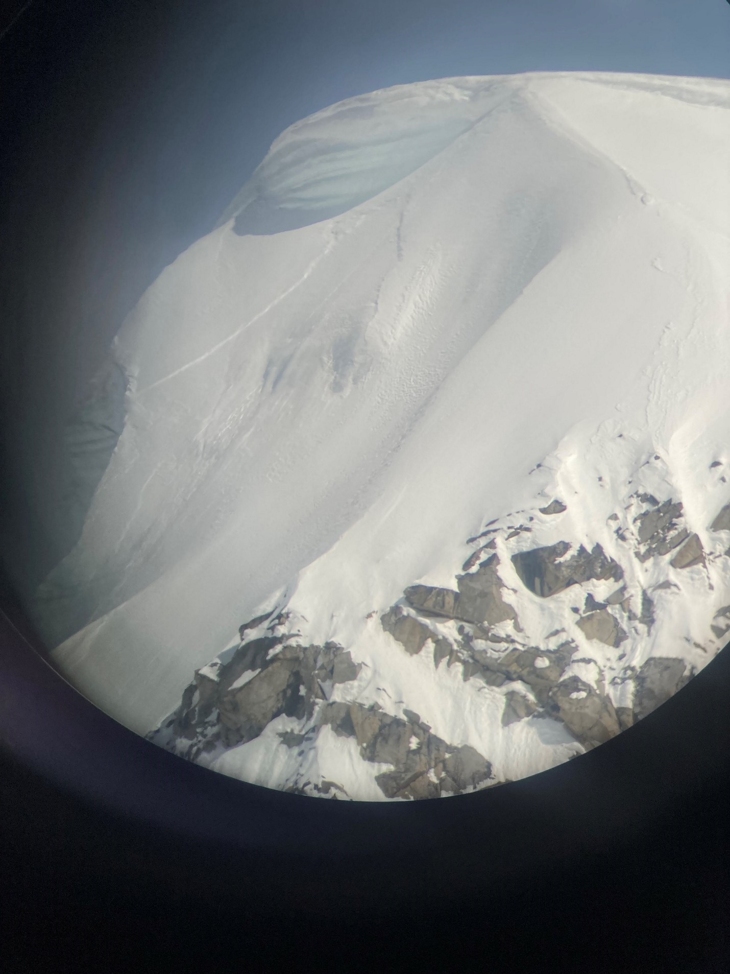 Slab avalanche observed from Kahiltna Base Camp View of an avalanche from the window of a plane