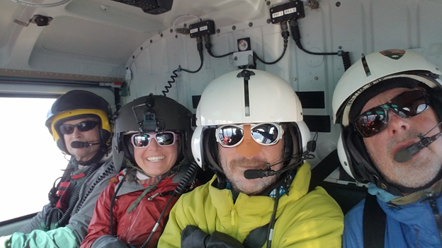 Four patrol members in the park helicopter