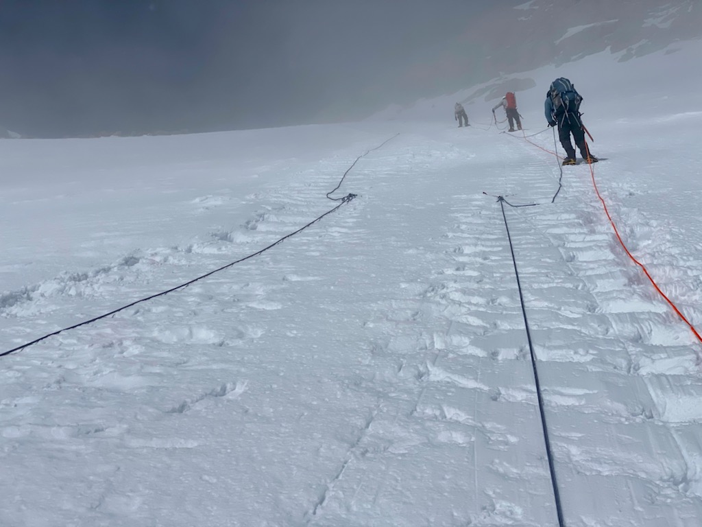 Camera looks up the fixed rope lines on the steep headwall 