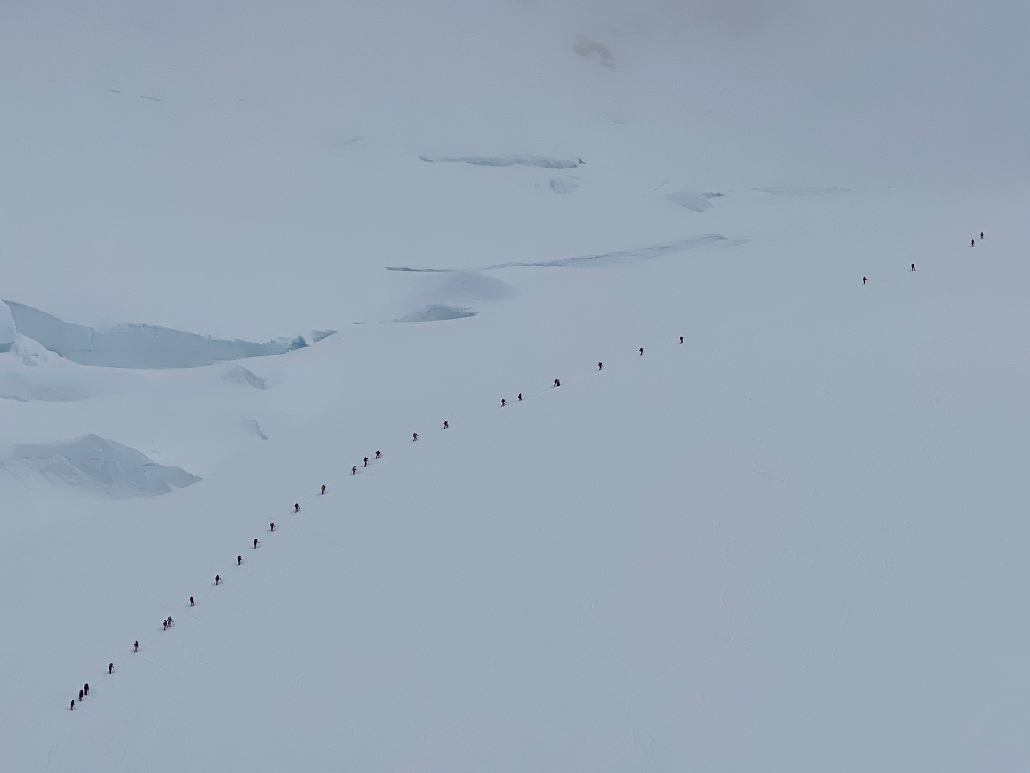 A line of climbers march upwards