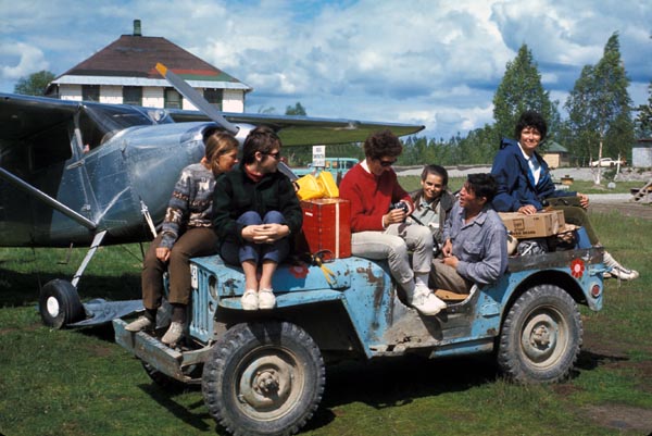 Gearing up for Denali A jeep full of women pose in front of a small aircraft