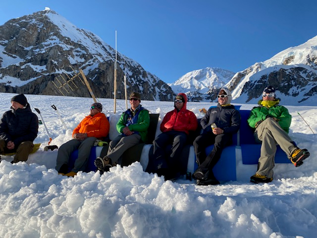 Couch potatoes Six mountaineers kick back on a snow couch
