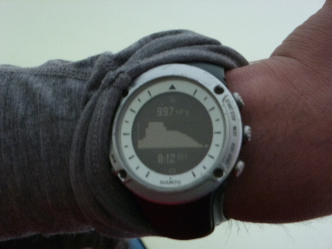 Dropping Pressure A watch face depicts dropping barometric pressure as a storm rolls in