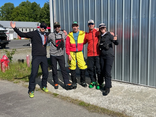 The Last Patrol of 2024 Five climbers pose next to an airplane hangar