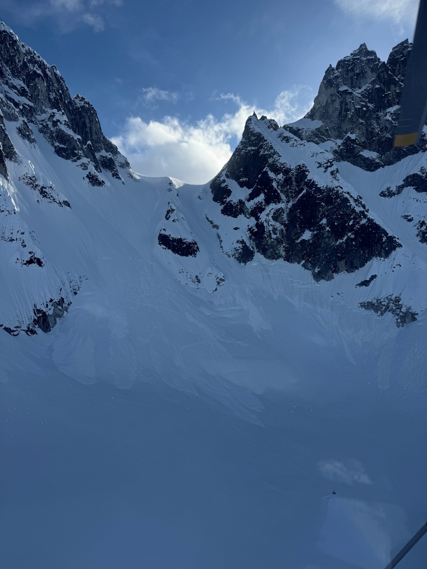 Overview of Grizzly Gap incident on May 13, 2025 Snow covered mountain peaks with blue sky in the background