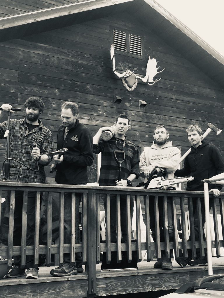 Five men standing on a deck