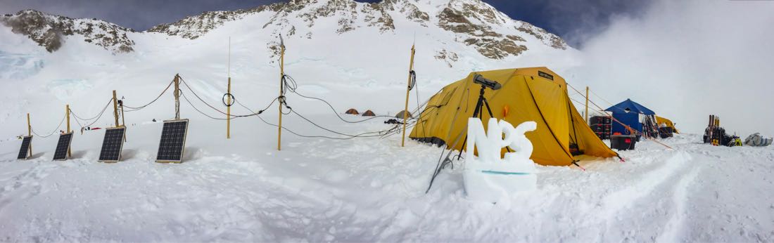 Teh 14K ranger camp is demarcated by a snow sculpture sign reading 'NPS'