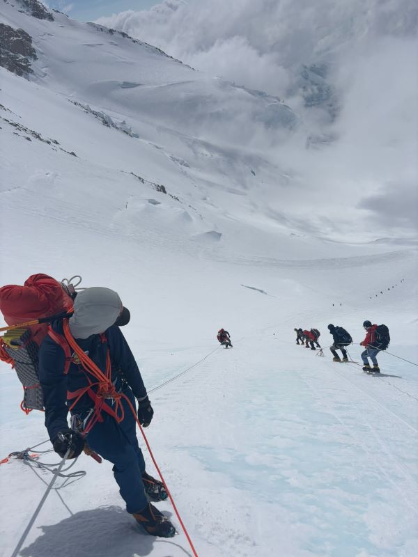 Mountain Conditions 6 rangers climbing on fixed lines