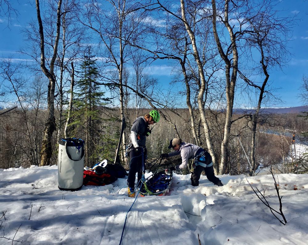 Rangers rope up the litter in preparation for lowering