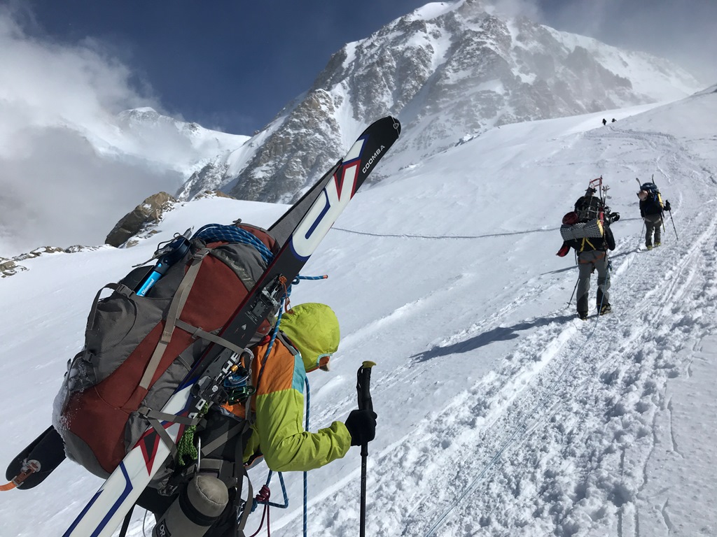 A rope team carries heavy packs up a section of the route called Squirrel Hill