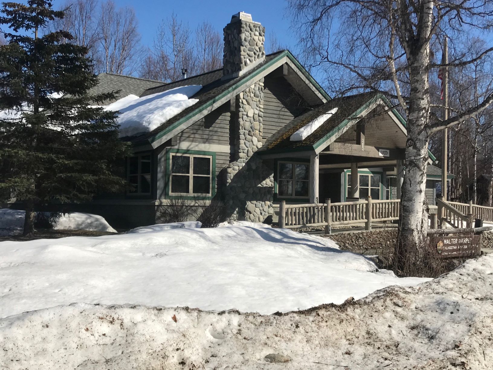 Ranger Station surrounded by spring snow piles