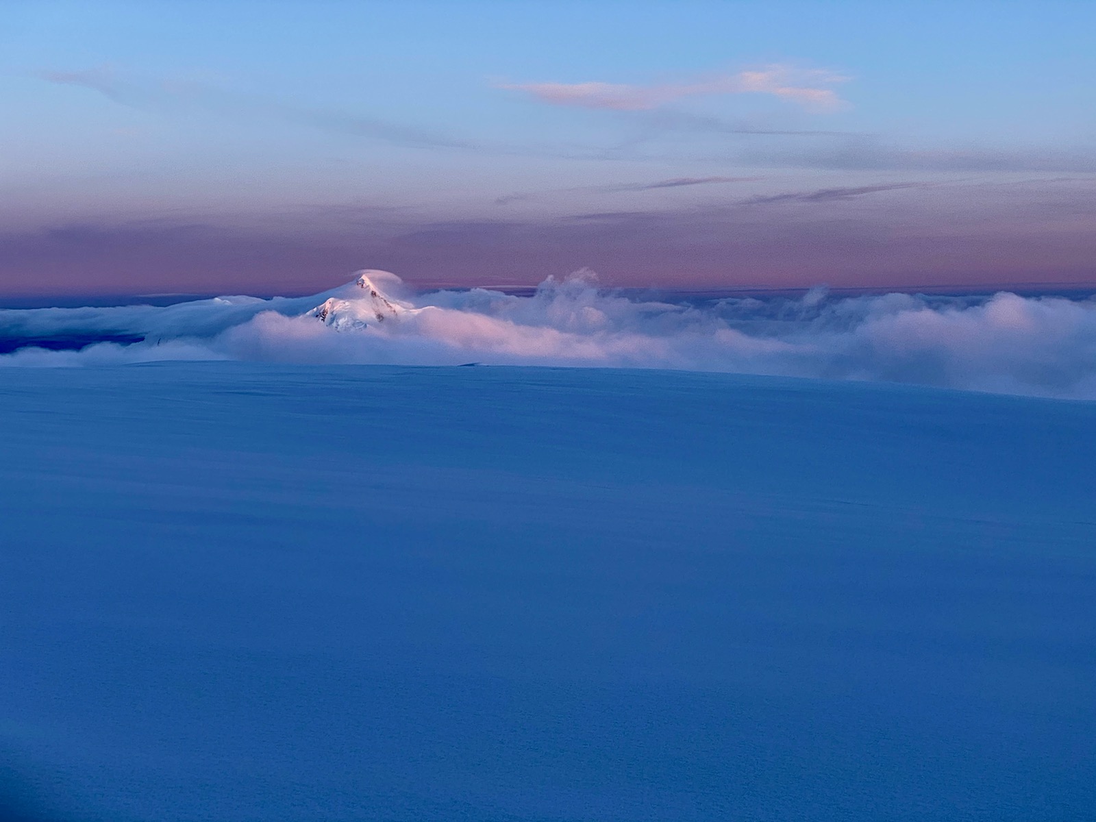 Alpenglow sunset over a mountain peak