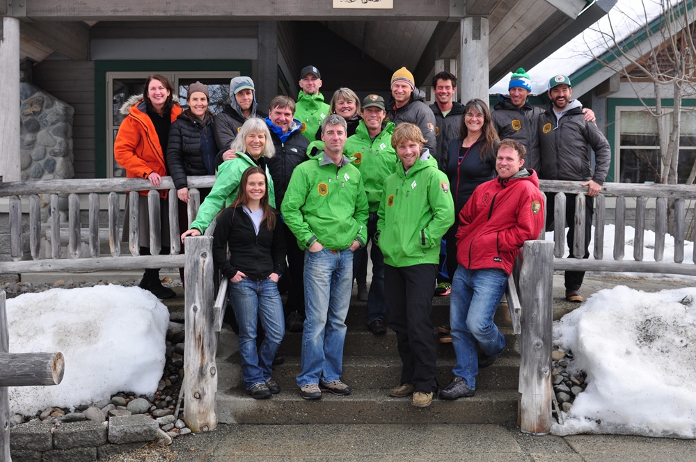 Staff members standing in front of Walter Harper Talkeetna Ranger Station