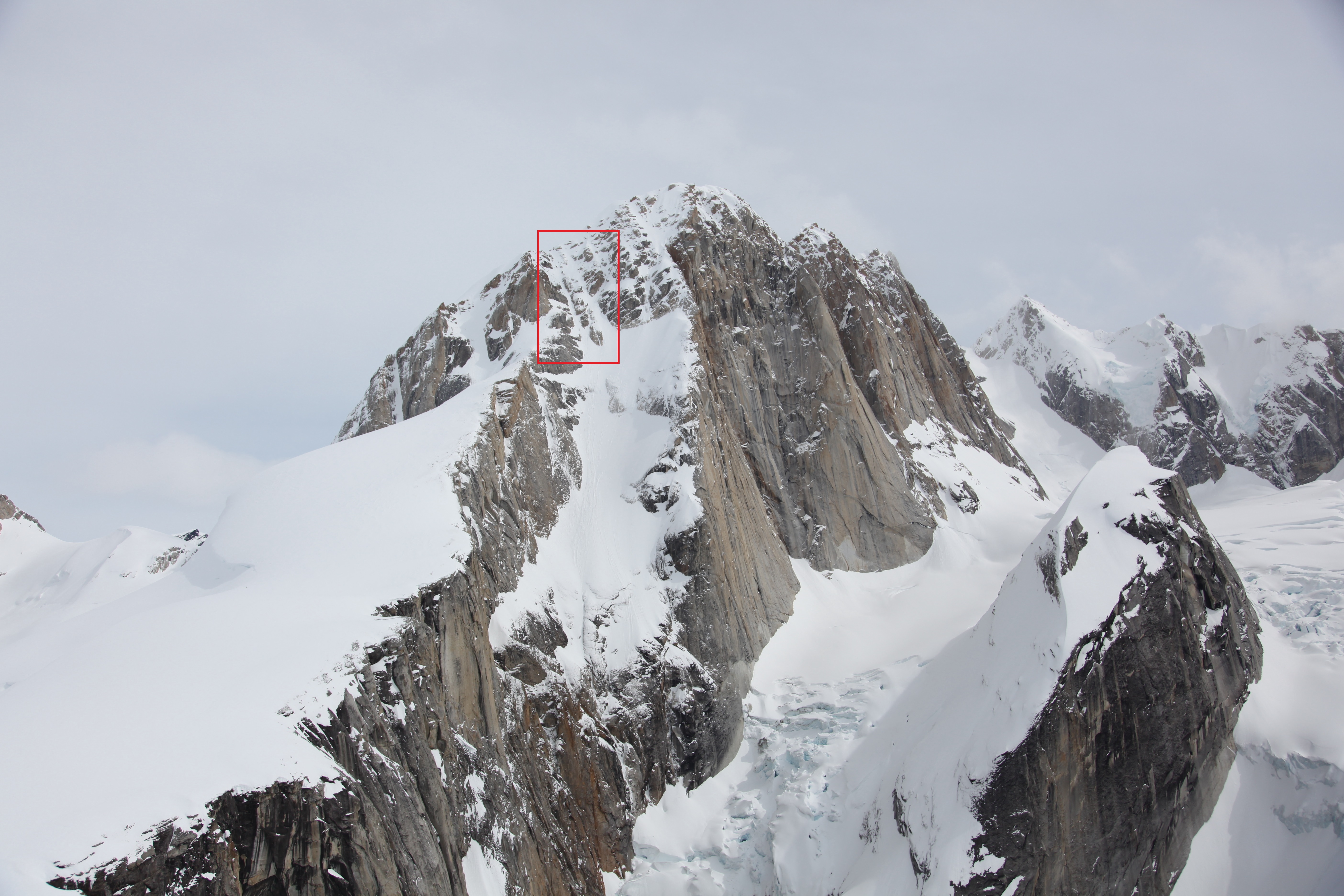 West Ridge of the Moose's Tooth View of steep mountain ridge with an overlayed red box near the summit