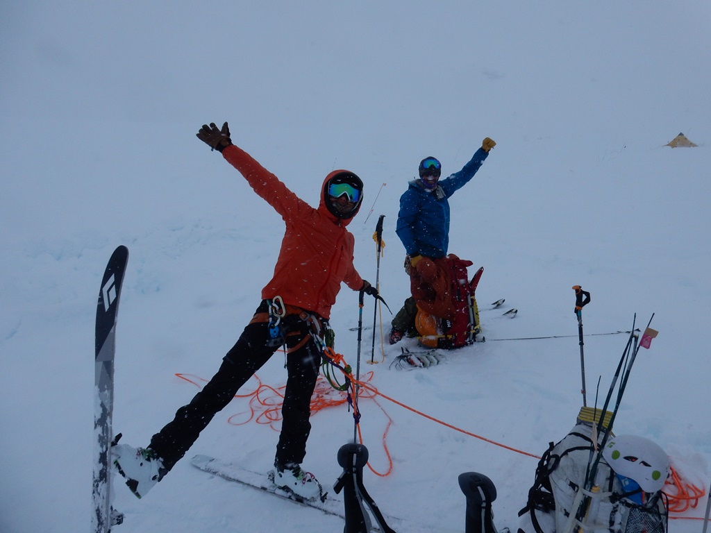 An NPS ranger and volunteer negotiate glacier travel in a whiteout