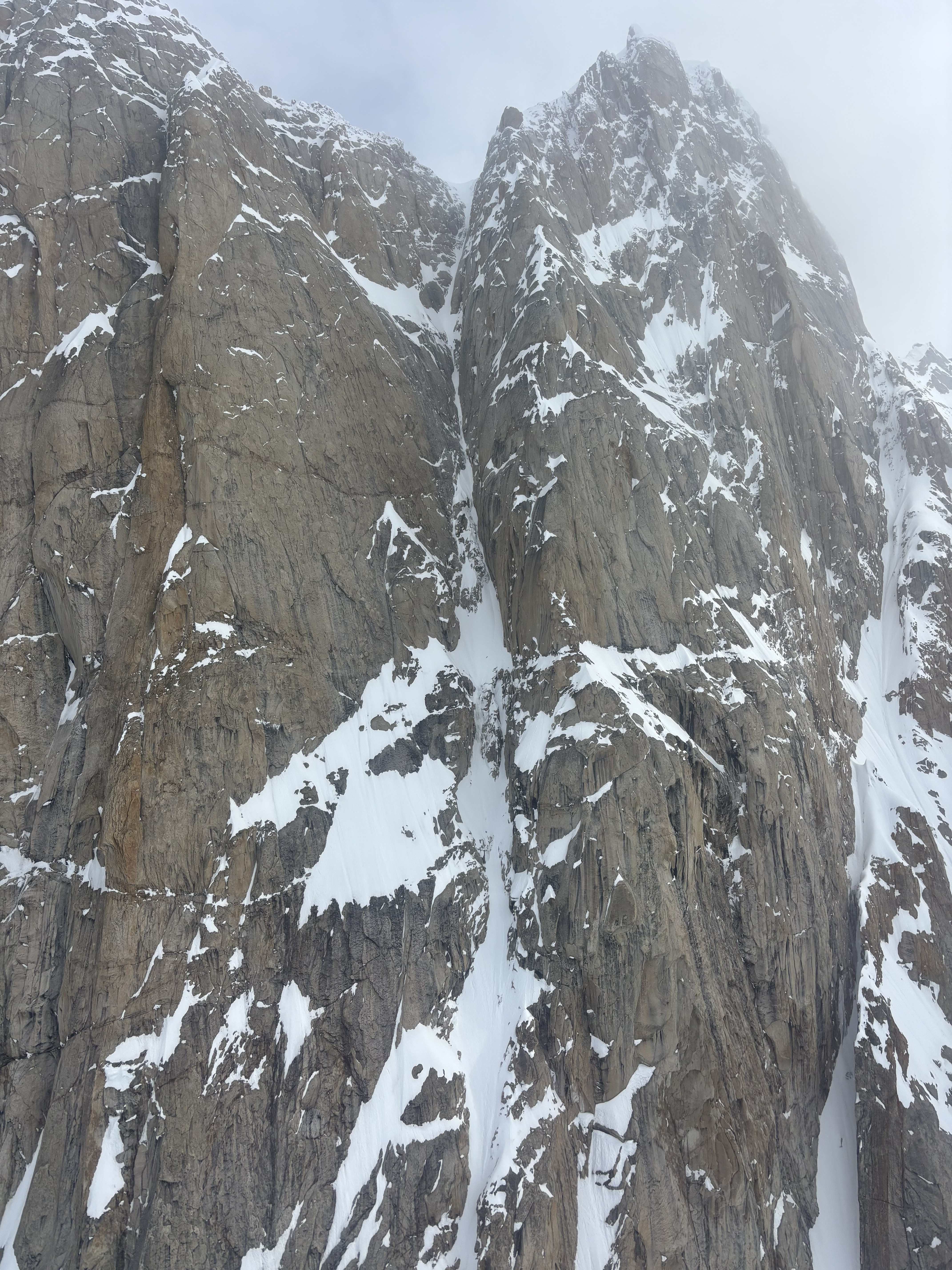 upper pitches of Ham & Eggs A pitch of snowy rocks ascending toward a grey sky