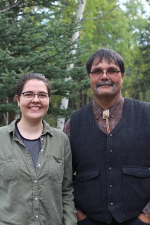a man and young woman posing for a photo