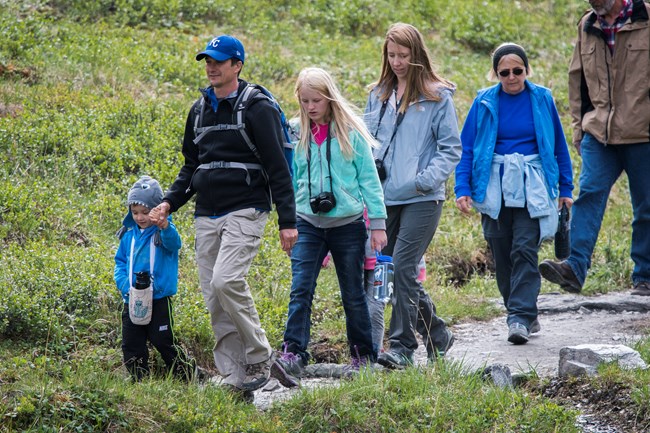 A family hiking on the savage river trail