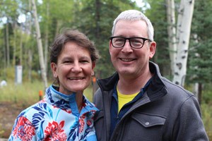man and woman posing for a photo