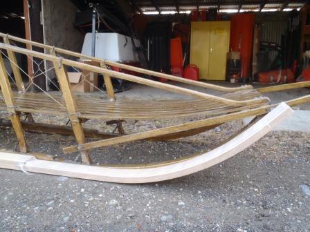 new runners sitting next to demo sled