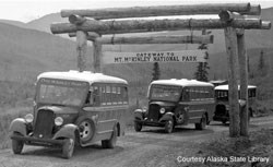 Buses pass through early gateway arch