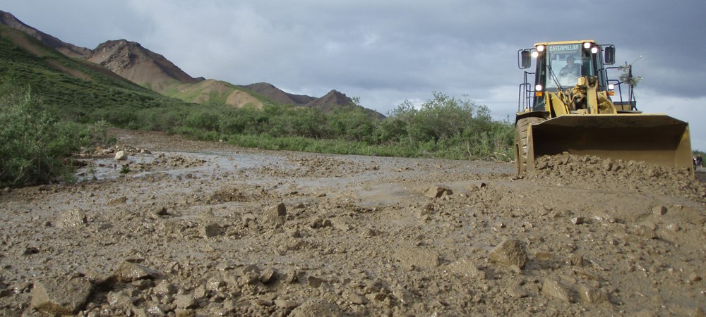 heavy equipment clear a debris flow cause by flooding heavy equipment clear a debris flow cause by flooding