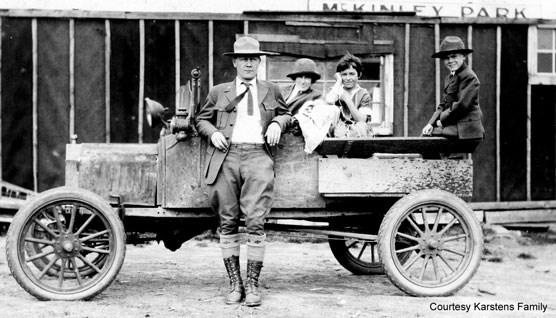 Karstens family standing near their vehicle