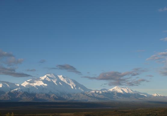 snowy Mount McKinley stands out against a blue sky