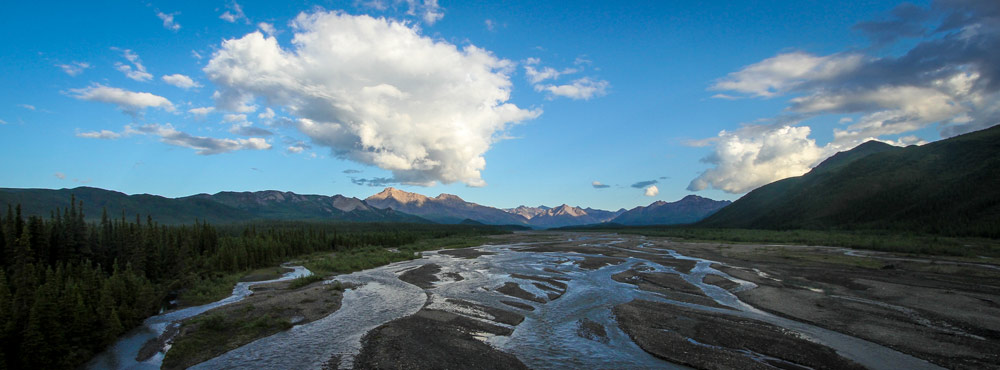 scenic, braided river flowing past mountains scenic, braided river flowing past mountains