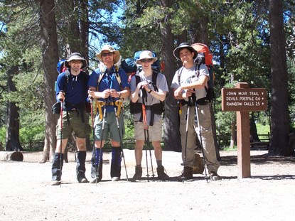 Four friends about to embark on a backcountry adventure from the Devils Postpile Ranger Station.