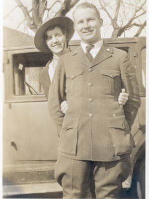 A black and white photo of a man in ranger uniform with his wife