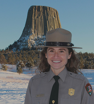 Amnesty Kochanowski Park Ranger with hat on devils tower in background