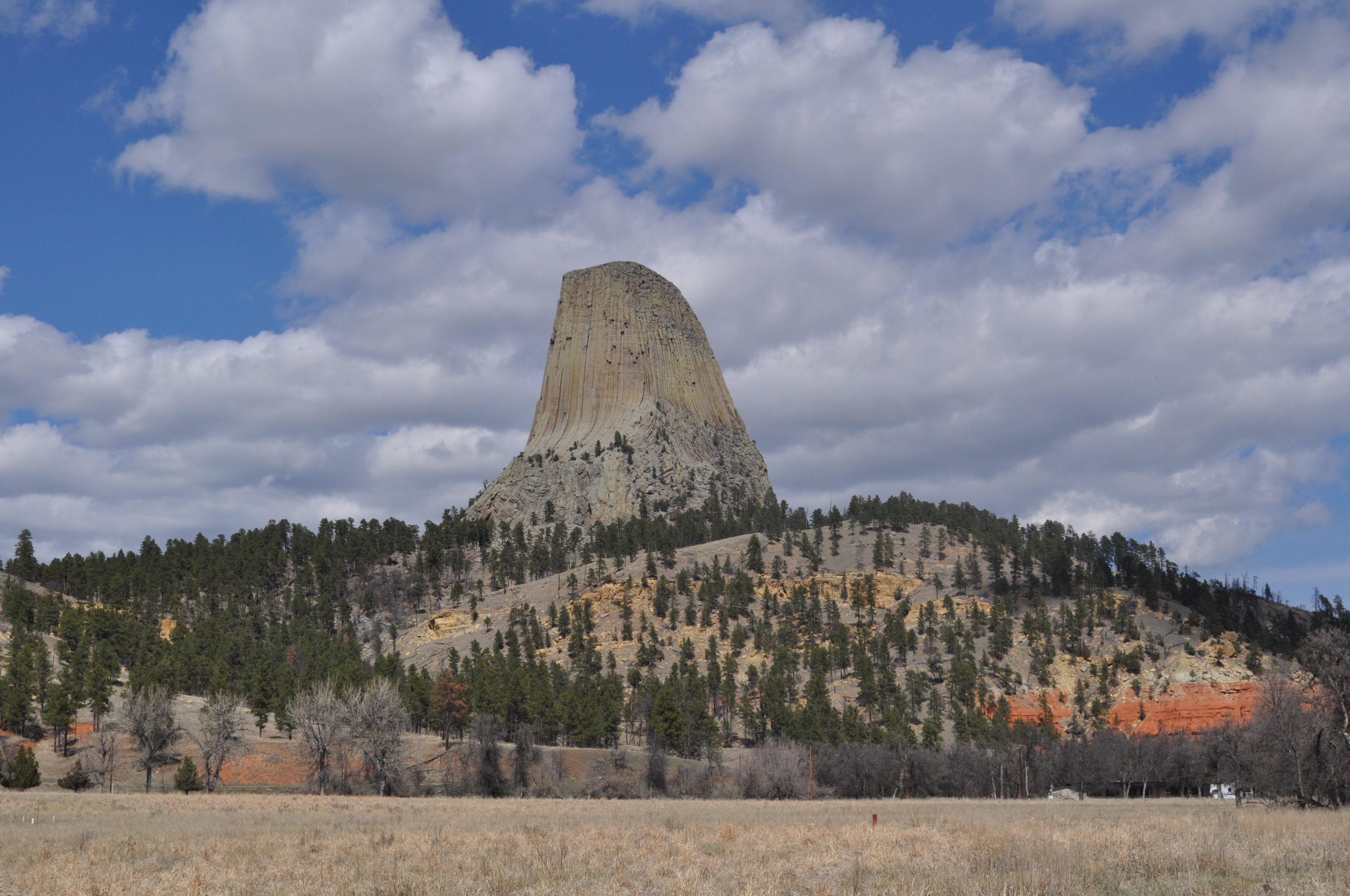 Large monolith with cumulus clouds in the background