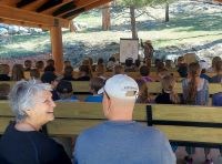 A ranger presents a program to a crowd