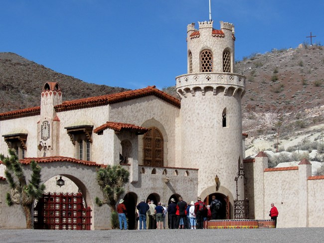 people outside a castle