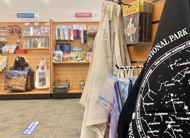 Books, bandanas, postcards and souvenirs on sales racks.