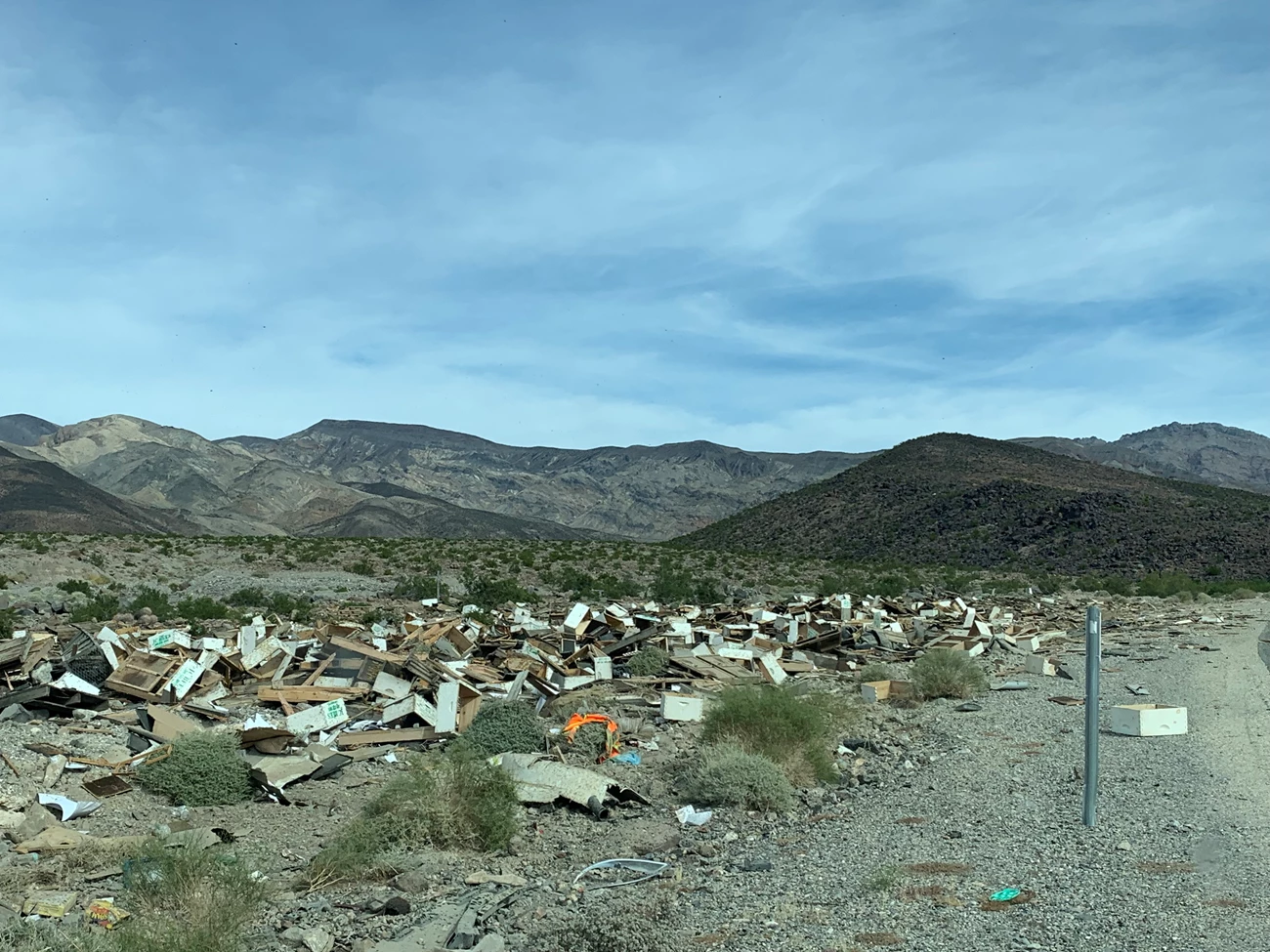 Scattered debris on the edge of a road.