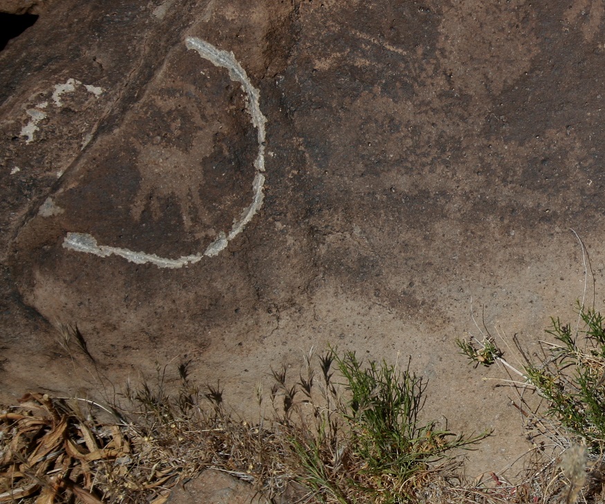 A vandal tried to remove this bighorn sheep petroglygh at a different archeological site in Death Valley National Park.