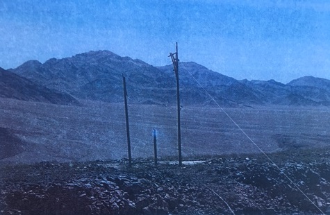 Three power poles burned after being struck by lightning.