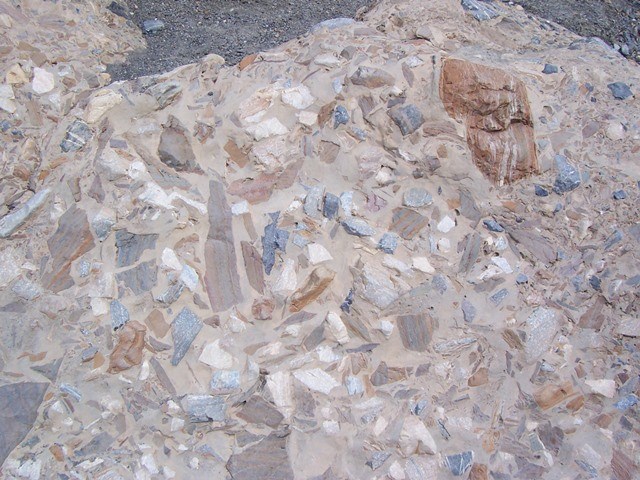 Fragments of rocks naturally cemented together called "breccia".