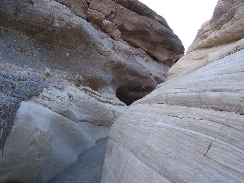 A canyon wall at a tight turn with polished marble walls.