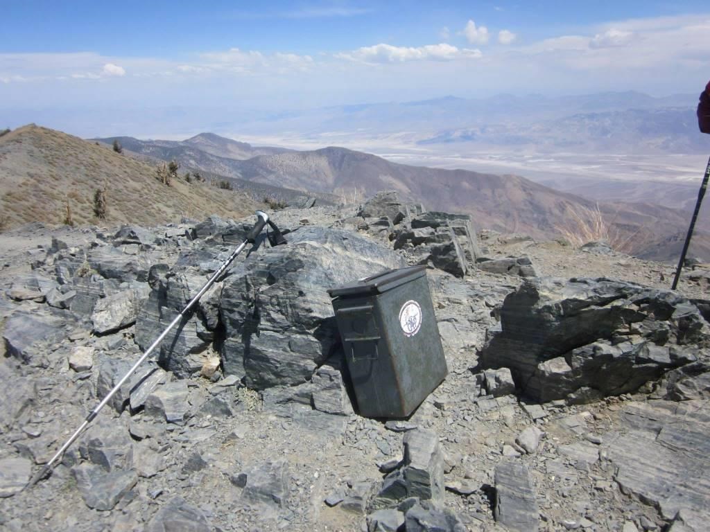 An old ammo can serves as a trail register on a high mountain peak.