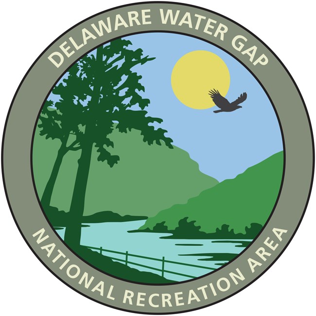 A circle logo with a picture of the Delaware Water Gap in the center.