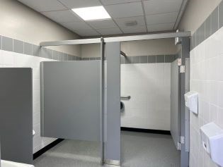 A newly renovated bathroom with white and gray tile.